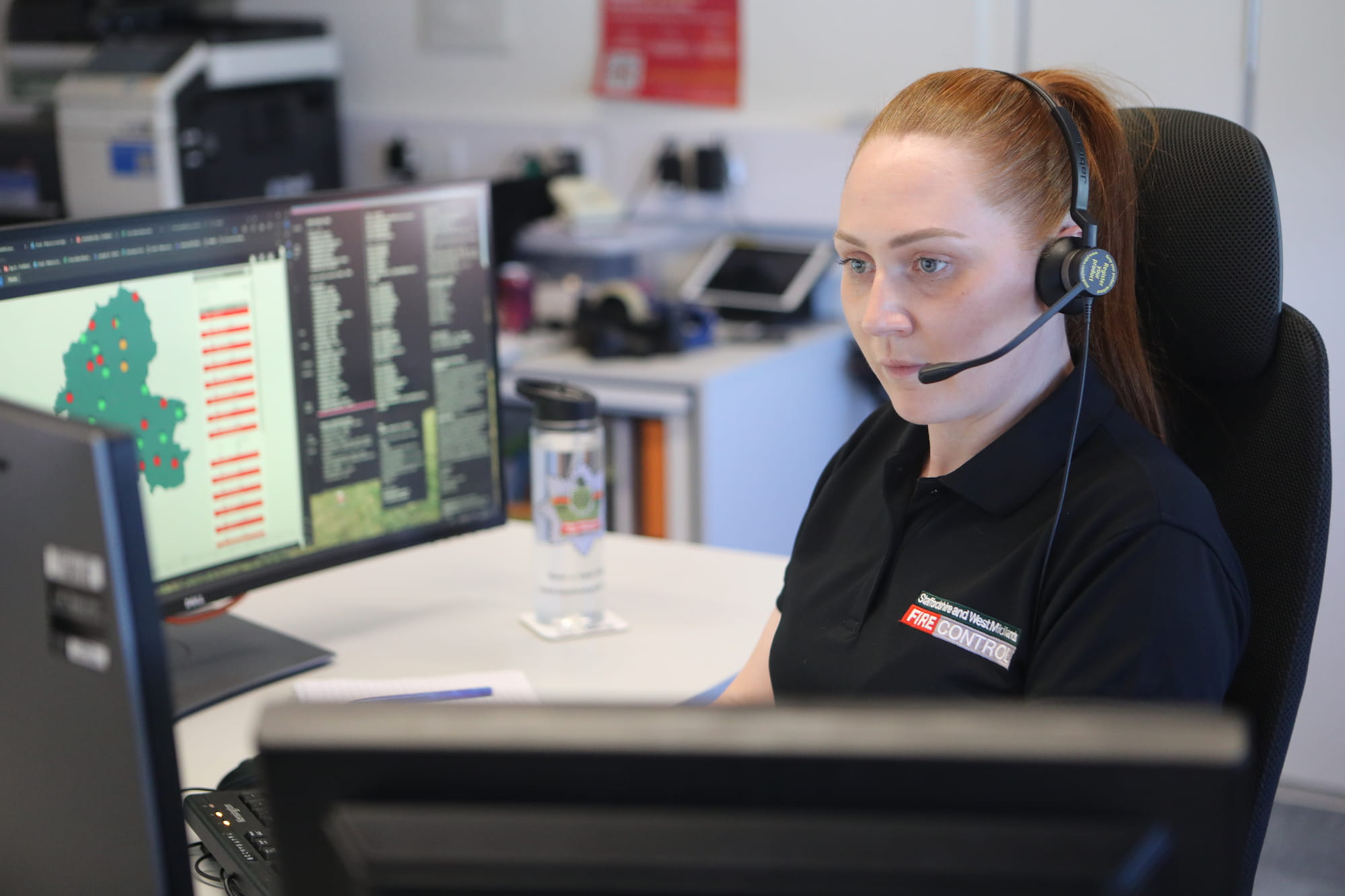 A file control operator looking at her screens in Fire Control