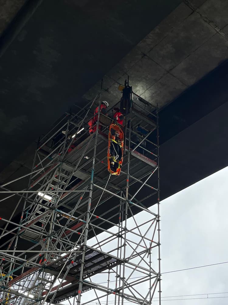 Technical Rescue firefighters performing a rescue with a longboard