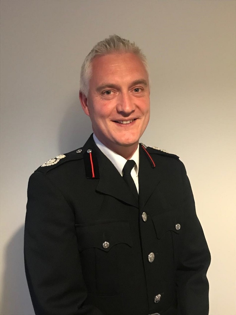 Chief Fire Officer Ben Brooks smiling in a photograph