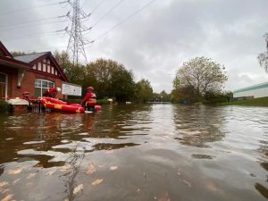 WMFS personnel with rescue sled in flood