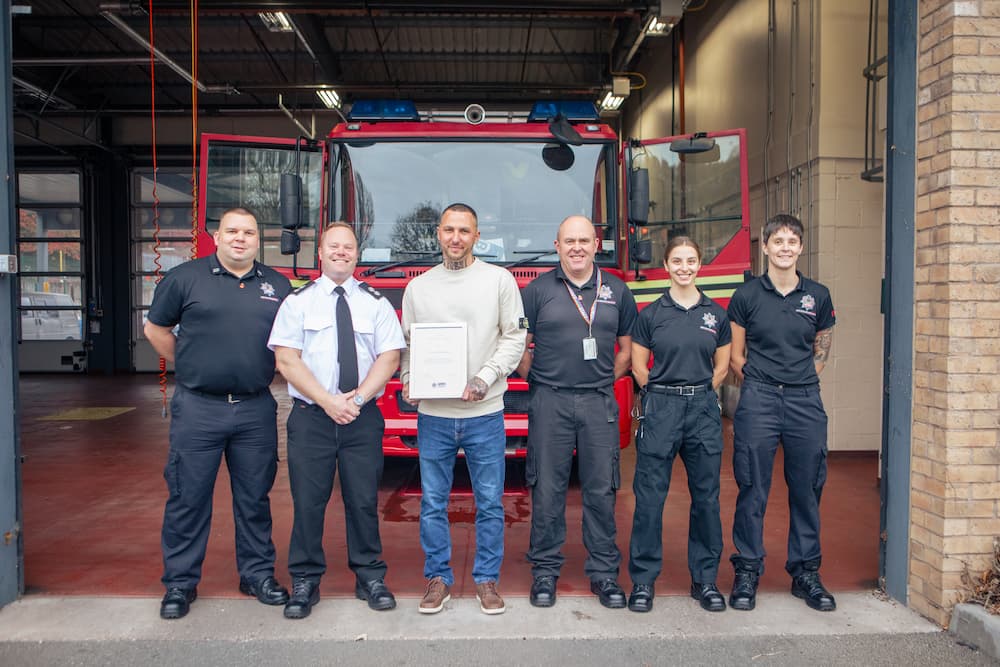 Tom Alexander pictured with fire crews from Haden Cross Station